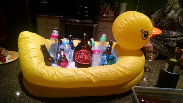 inflatable duck cooler filled with beer and baby bottles