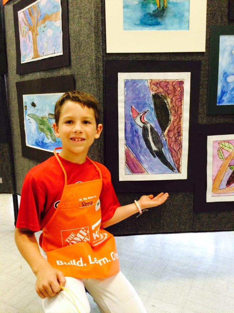 Reese with his submission to the art exhibit. 