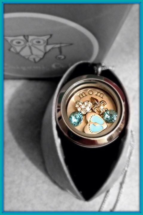origami owl locket filled with blue crystals