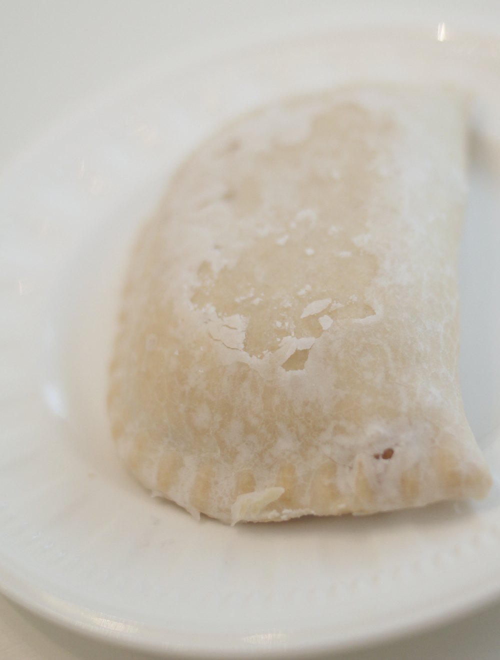 close up of a haydel's hand pie on a white plate
